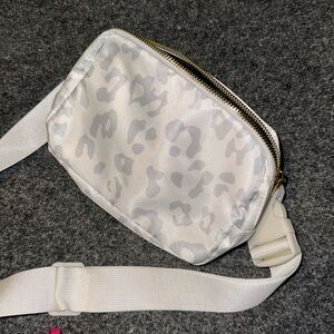 NEW White & silver cheetah belt bag with pockets inside.